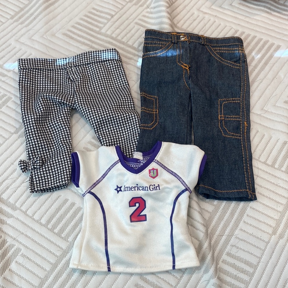 Random American girl doll jeans, plaid pants, and jersey.